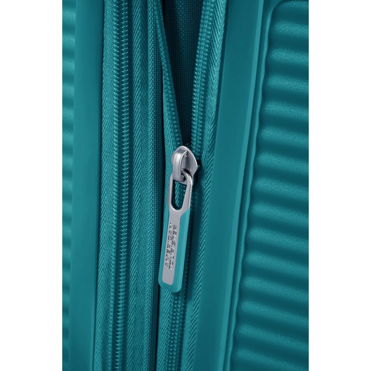 American Tourister Soundbox - bővíthető, négykerekű közepes bőrönd 67 (32G**002)